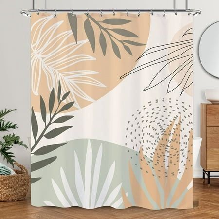 the shower curtain is decorated with tropical leaves