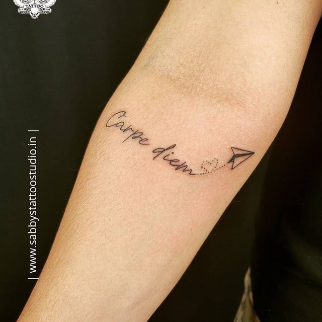 a person with a tattoo on their arm that says, love you and an arrow