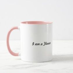 a pink and white coffee mug with the words i am a floss on it