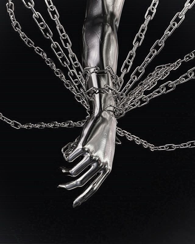 a hand with chains hanging from it's middle is shown in black and white