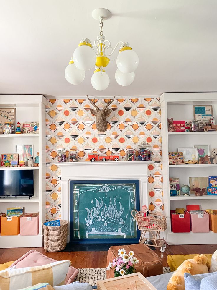 a living room filled with lots of furniture and a chalkboard in the middle of it