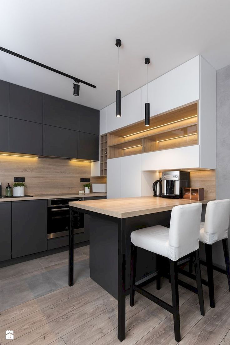 a kitchen with white chairs and wooden counter tops