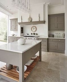 a large kitchen with an island in the middle