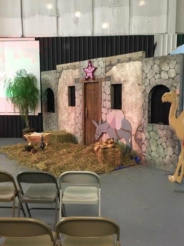 a fake nativity scene is set up with chairs