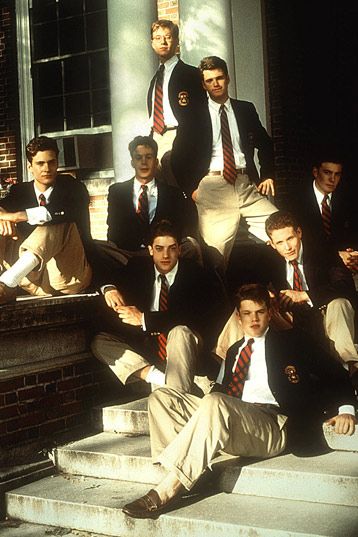 a group of young men in suits and ties posing for a photo on the steps