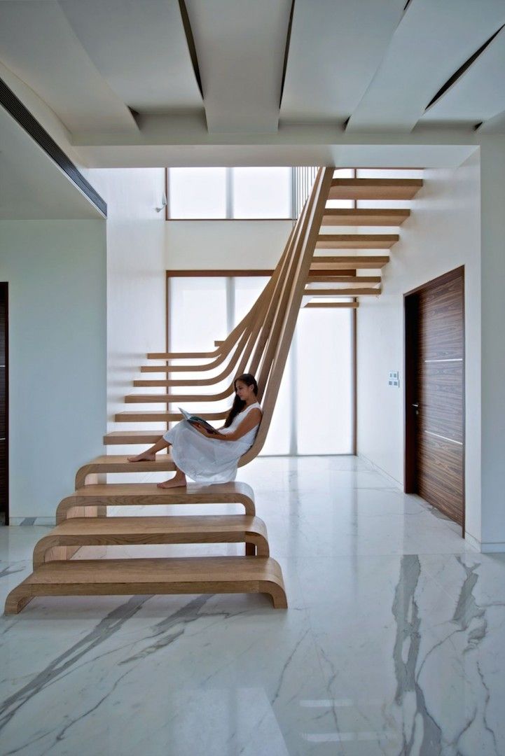 the stairs are made of wood and have been designed to look like an abstract piece of art