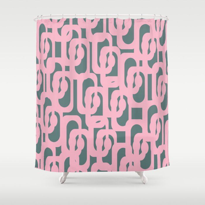 a pink and grey shower curtain with circles on it