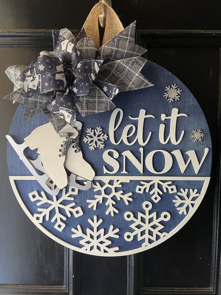 a door hanger that says let it snow