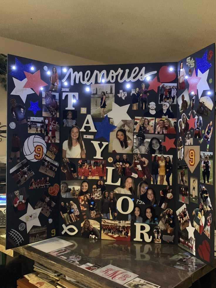 a table topped with pictures and lights next to a wall covered in photos that spell out memories