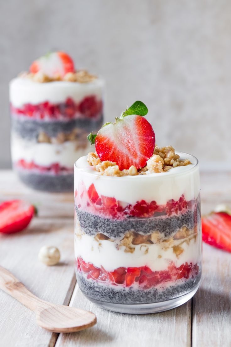 a dessert in a glass with strawberries on top