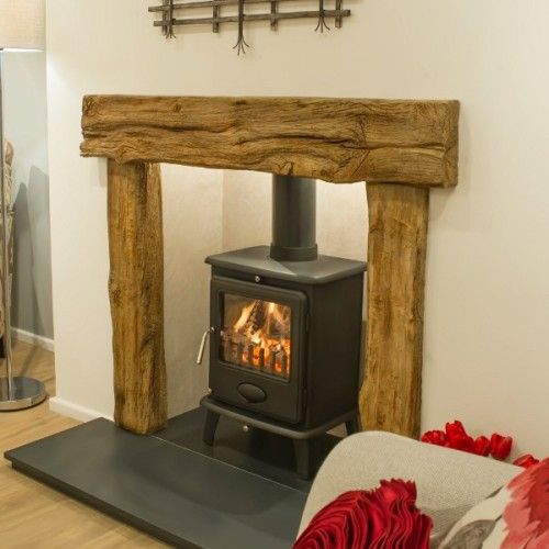 a wood burning stove sitting inside of a living room