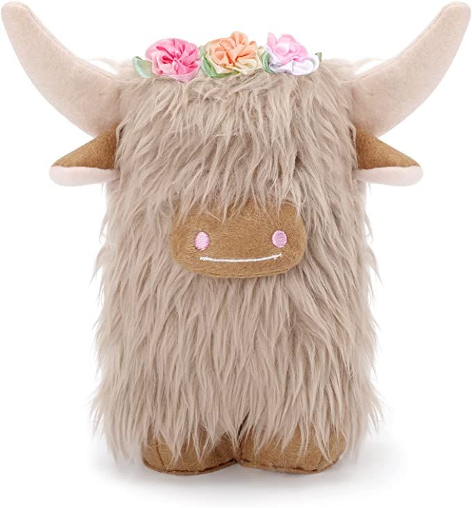 a stuffed animal with flowers on its head