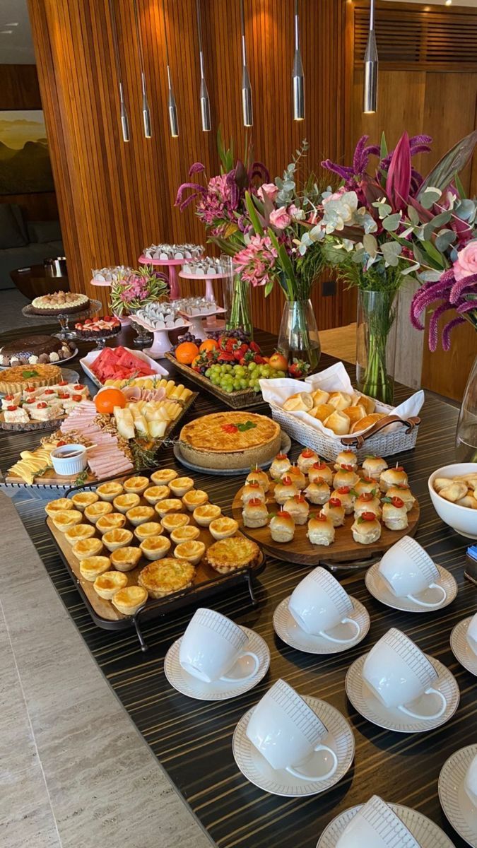 a buffet table filled with lots of different types of food and desserts on plates