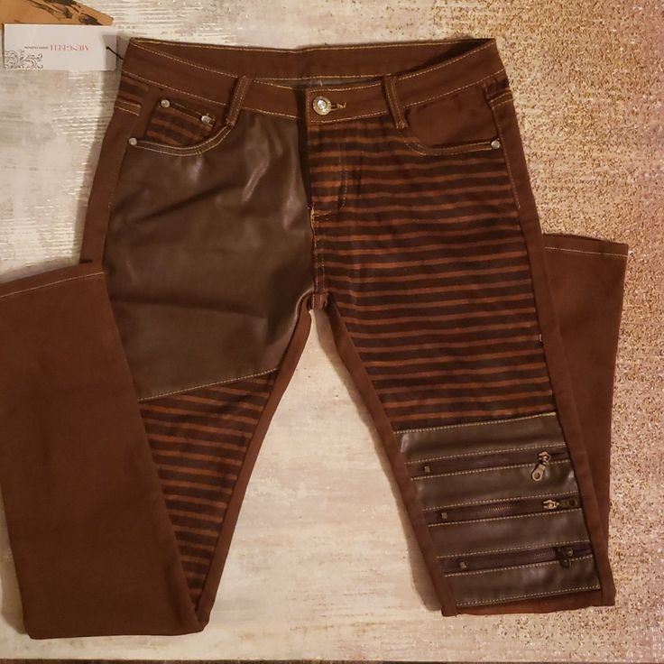 These Are The Coolest Jeans/Pants. There Is A Mixture Of Materials Leather/Suede, Zippers On Left Knee And Rhinestones For Closure Button And Rhinestone Accents On Back Pockets. I Have My Own Pair And I Always Get The Most Compliments. Trendy Faux Leather Jeans For Fall, Trendy Brown Bottoms With Zipper Closure, Casual Faux Leather Jeans For Fall, Brown Bottoms With Zipper Closure For Spring, Trendy Fitted Faux Leather Jeans, Trendy Fitted Brown Jeans, Edgy Fitted Brown Bottoms, Edgy Brown Fitted Bottoms, Leather Jeans For Fall With An Edgy Style