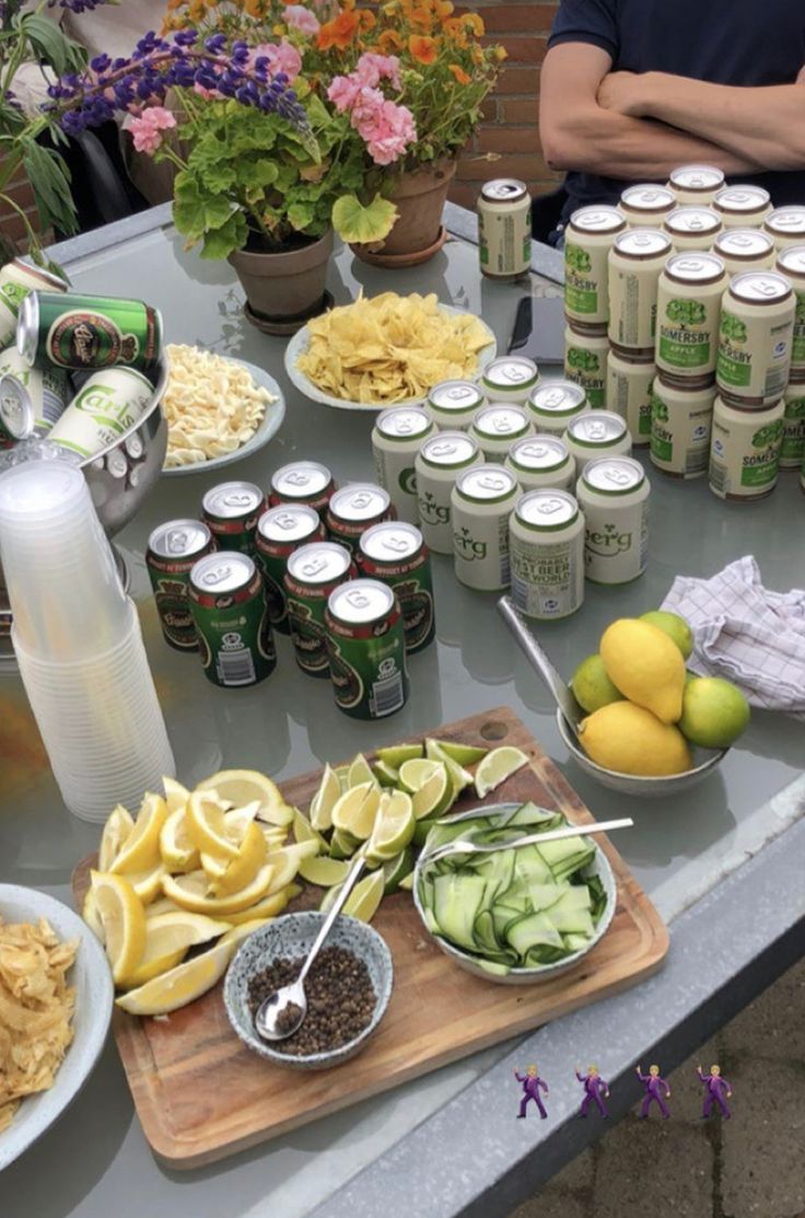 a table topped with lots of food and drinks