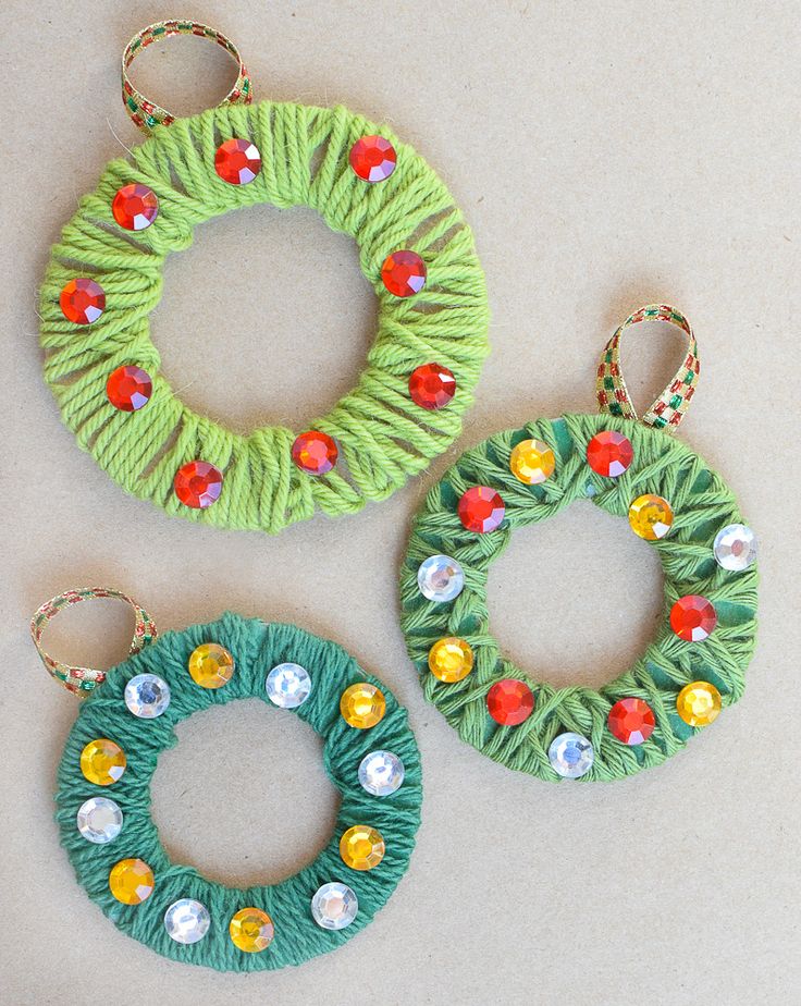 yarn wrapped wreath ornaments with text overlay