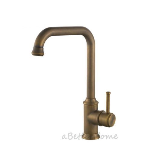 an antique brass faucet on a white background