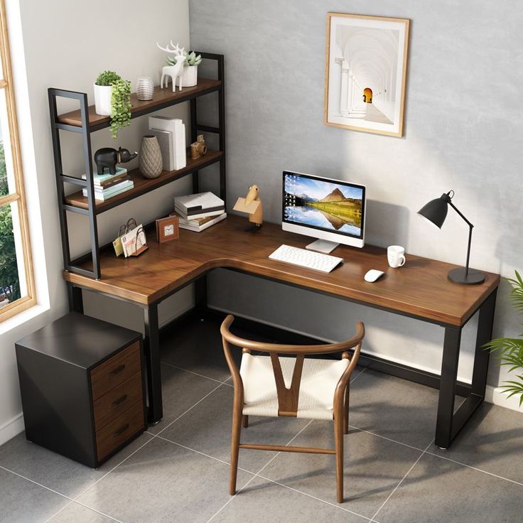 a corner desk with a computer on it