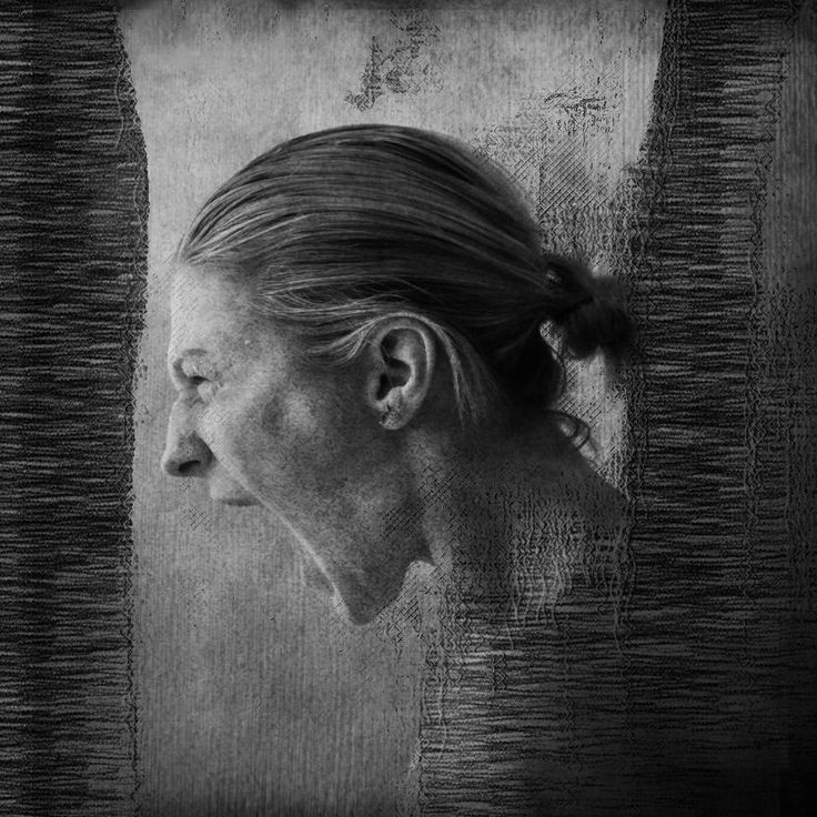 an older woman's profile is shown in this black and white photo, as if she was looking out the window