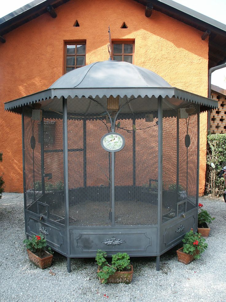 a gazebo sitting in front of a building