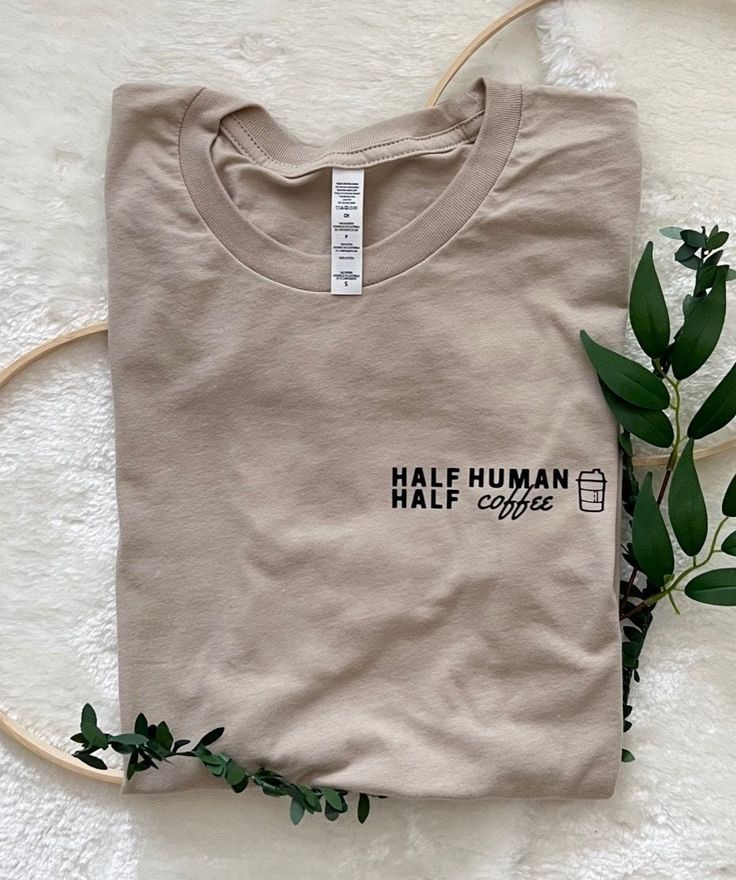 Visit 100daysco.com for more styles and cheaper pricing. Half Human Half Coffee Tee MATERIAL: T-shirt is made out of 52% cotton and 48% polyester. SIZING: Unisex sizing with tapered fit. WASHING INSTRUCTIONS: Garment is best washed inside out on a cold setting, tumble dry low. Custom Tshirts Cafepress, Everyday Cotton Coffee-colored Tops, Everyday Coffee Cotton Top, Coffee Shop Shirt, Starbucks Cafe, Coffee Graphic Tee, Boho Style Design, Coffee Outfit, Coffee Tees