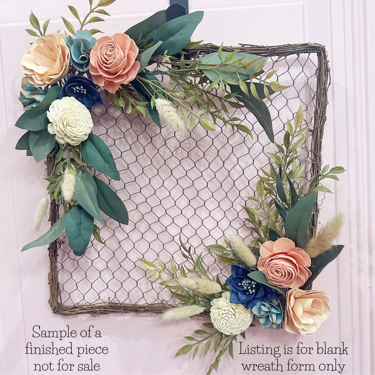 an arrangement of flowers and greenery is displayed on a white background with the words sample of a finished piece not for sale