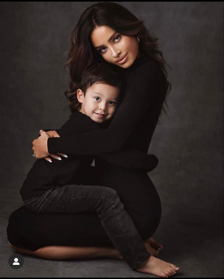 a woman and child posing for a photo