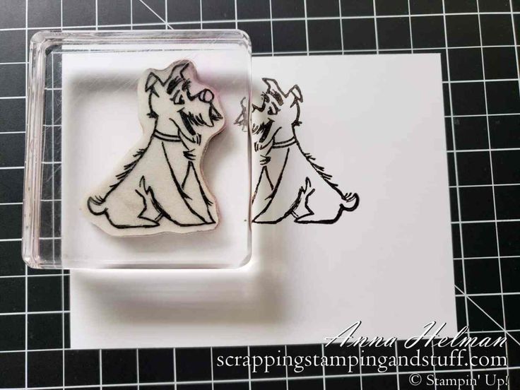 a stamp with two dogs on it and one is in the shape of a dog