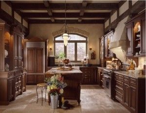 a large kitchen with wooden cabinets and an island