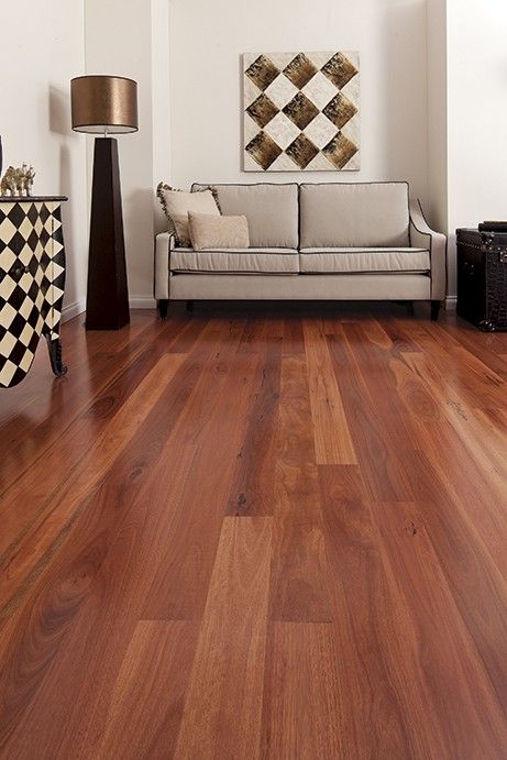 a living room with wood floors and white walls