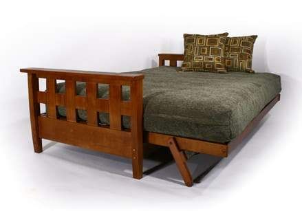 a wooden bed frame with two pillows on it