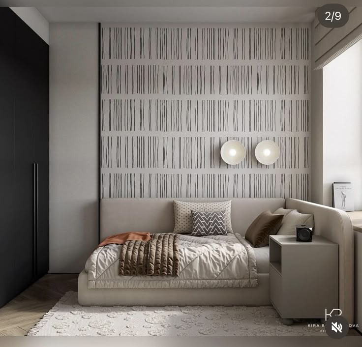 a bed sitting in the middle of a bedroom next to a wall with vertical stripes on it