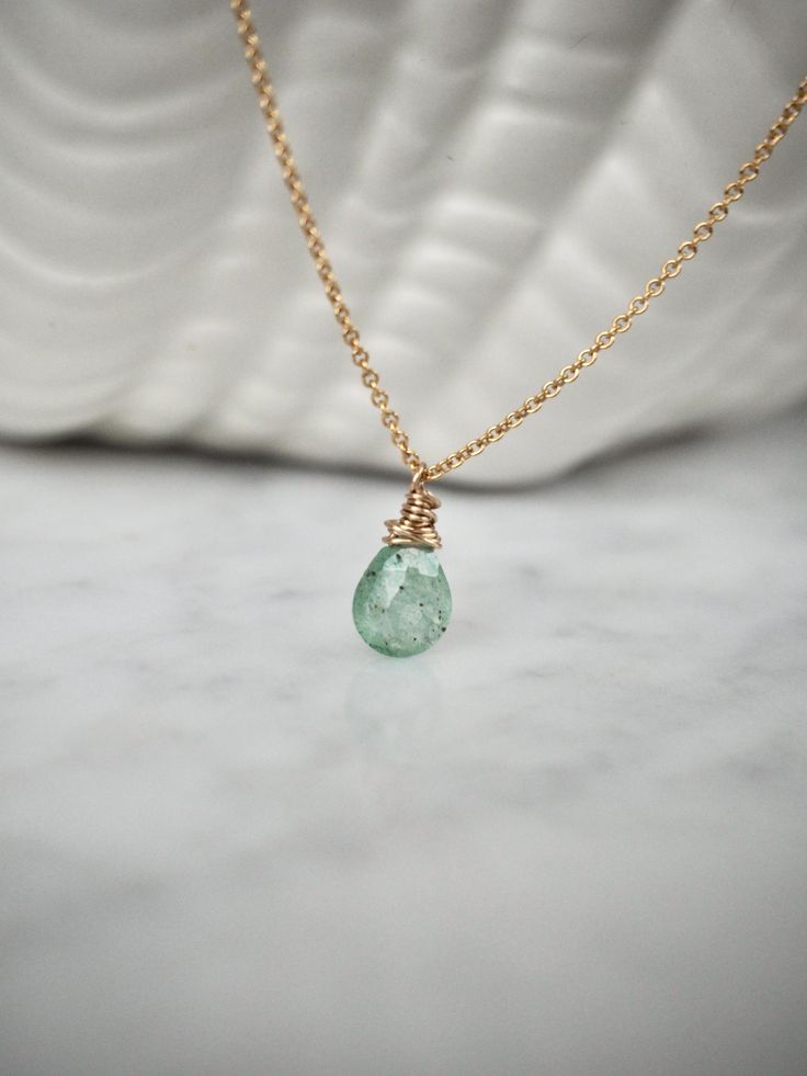 Dainty and delicate, this pretty necklace feature gorgeous forest green aventurine briolette wrapped in gold on a 14 k gold filled chain. Layer it with your favorite necklaces, or wear it alone - it's perfect either way! Please note that as this is a natural stone, each stone is unique and has its own individual characteristics. Colors of stones vary and may look different to how you view them on your monitor.  Made using the highest quality USA and UK sourced materials. Aventurine💚 Green avent Aventurine Crystal Necklaces, Everyday Green Teardrop Pendant Jewelry, Delicate Green Necklace With May Birthstone, Delicate Green May Birthstone Necklace, Delicate Green Necklace For Everyday Wear, Green Wire Wrapped Necklace For May Birthstone, Green Briolette Necklace For Gift, Green Briolette Necklace Gift, Aventurine Gemstone Necklace For May Birthstone