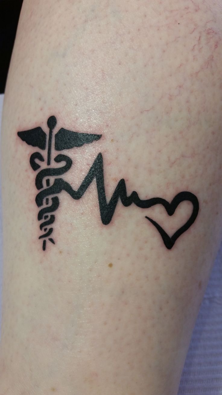 a tattoo on the leg of a person with a stethoscope