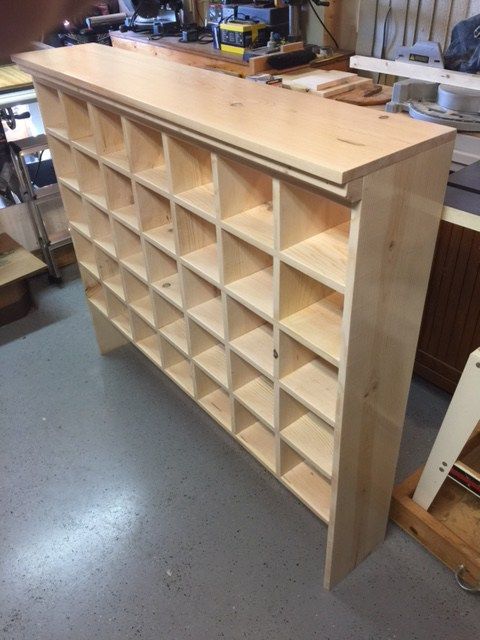 a large wooden shelf with lots of shelves on it