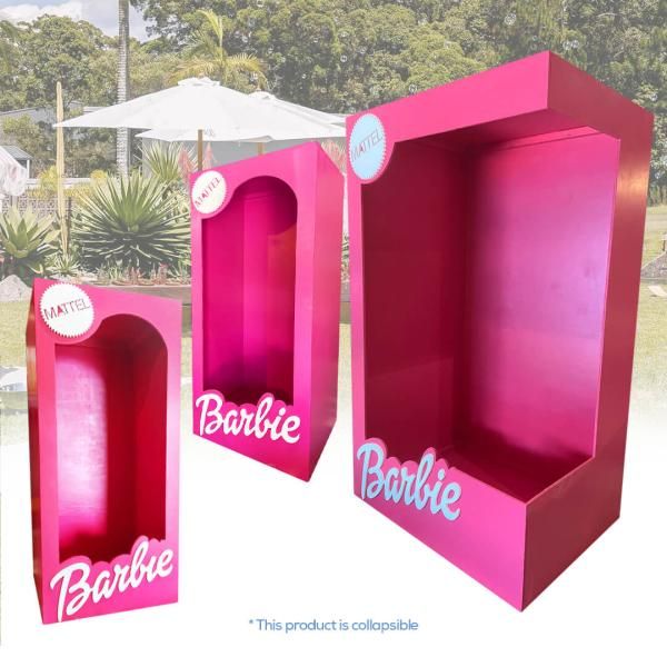 two pink boxes with barbie written on them