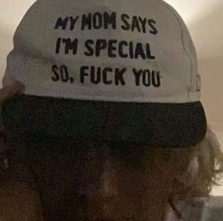 a person wearing a hat that says my mom says i'm special so, fock you