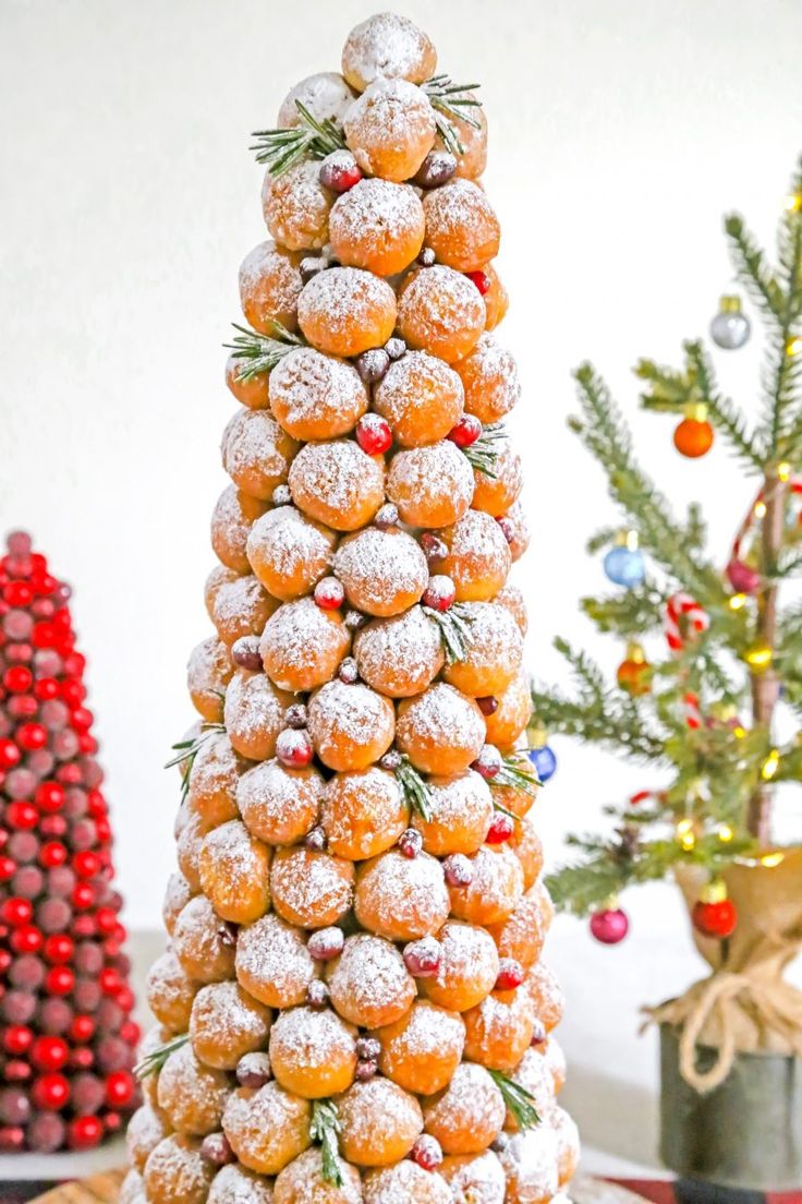 a christmas tree made out of donuts and powdered sugar