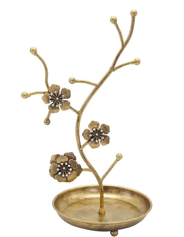 a gold plate with flowers in it on a white background and the base is made out of metal