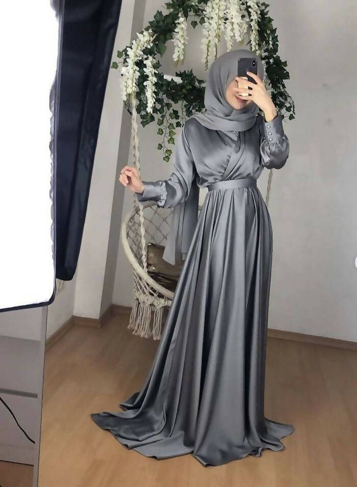 Exclusive modest gown crafted in premium Satin silk for quality & durability.It features a tie neckline for elegance,concealed& back zipper closure.fit & flare silhouette This beautiful gown wont disappoint. Model is wearing S in Grey.Hijab will not be matching as the materials will be different!Final sales No exchanges No refunds. In case of a defect, please make an open parcel video! *No claim will be entertained without an open parcel video!** Ivory white maybe see through match it with our s Hijab Dress Party, Muslim Evening Dresses, Stile Hijab, Mode Turban, Soiree Dress, Modesty Fashion, Muslim Fashion Dress, Muslim Outfits, Muslim Dress