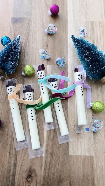 some toothbrushes are laying on the floor next to christmas decorations