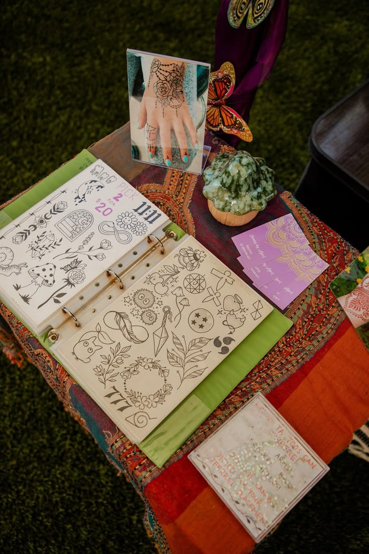 a table topped with lots of different types of tattoos