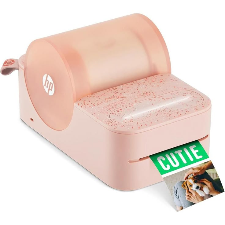 a pink printer with a cutie sticker next to it