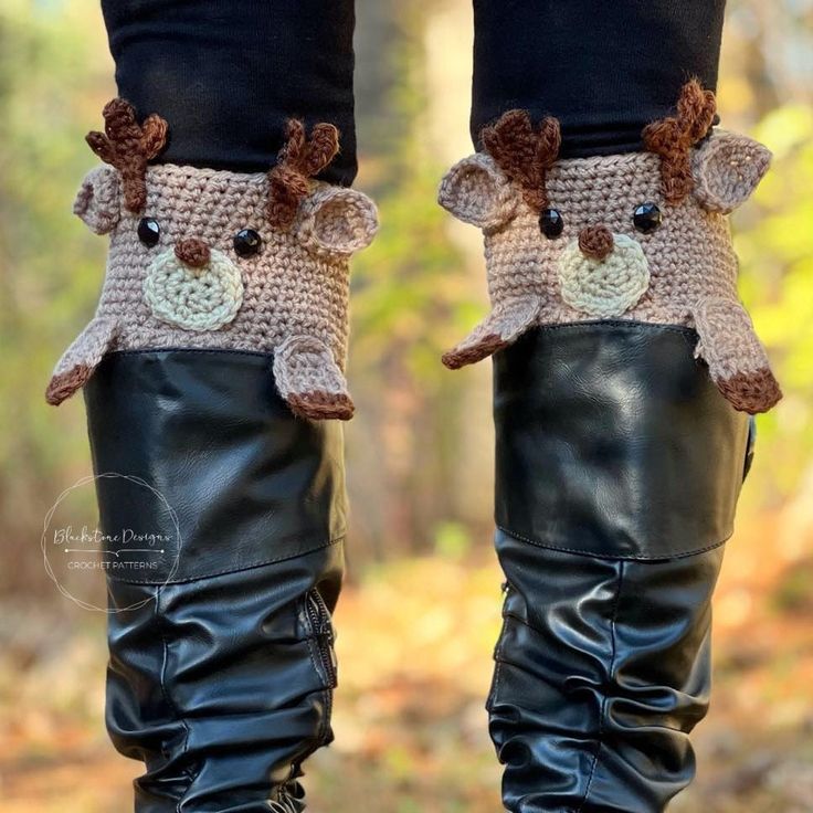 there is a pair of boots that have been made to look like animals on them