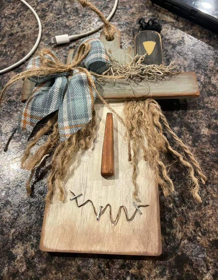 a wooden board with some writing on it next to a corded phone and other items