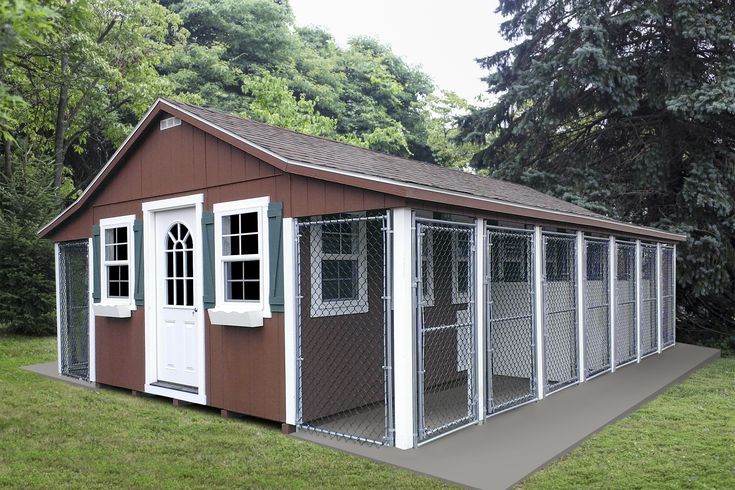 a small red shed with white doors and windows