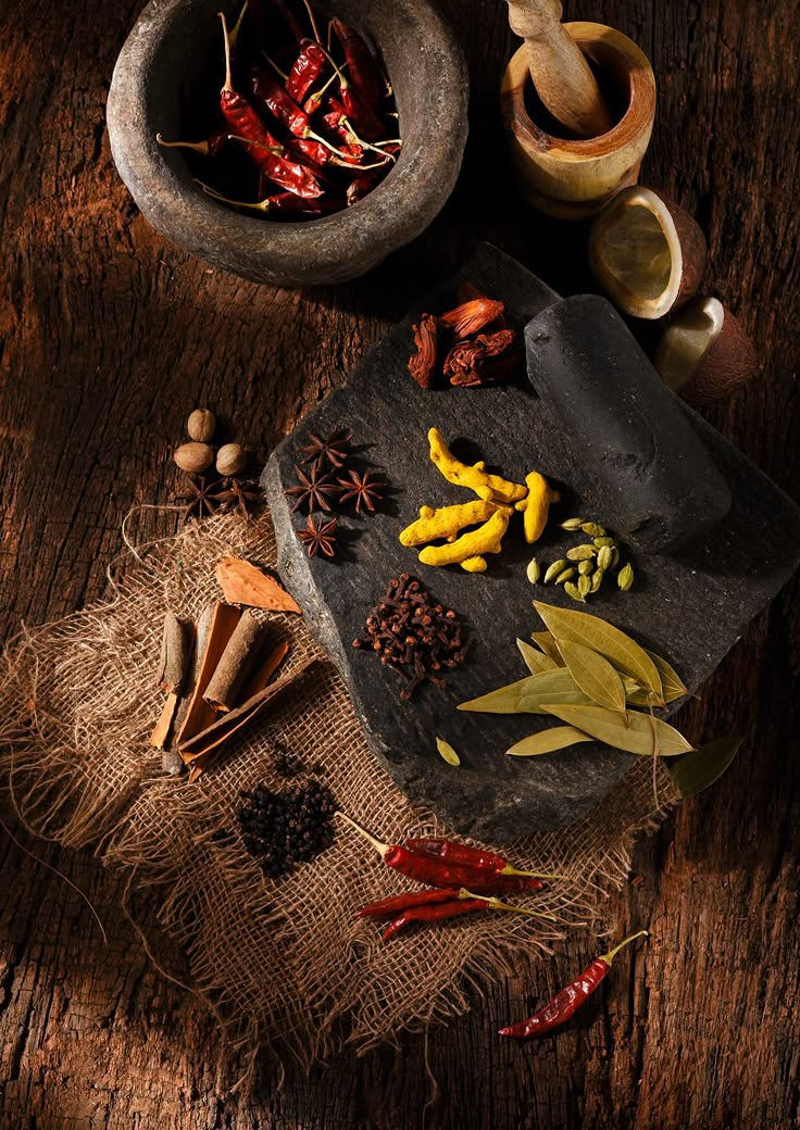 an assortment of spices and herbs on a table