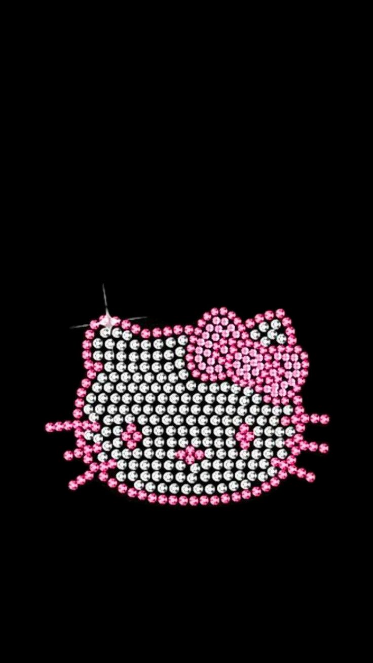 a hello kitty iron - on sequin applique is shown in pink and white