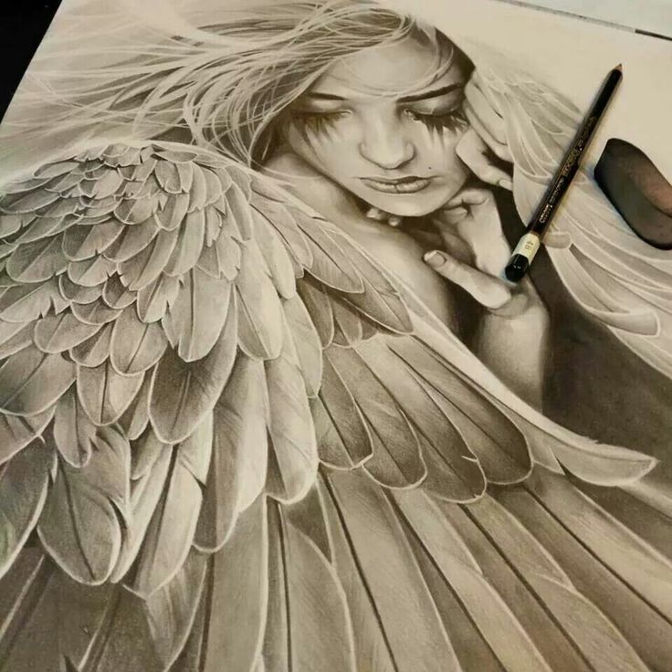 a pencil drawing of a woman with wings on her face and hand next to a pair of scissors