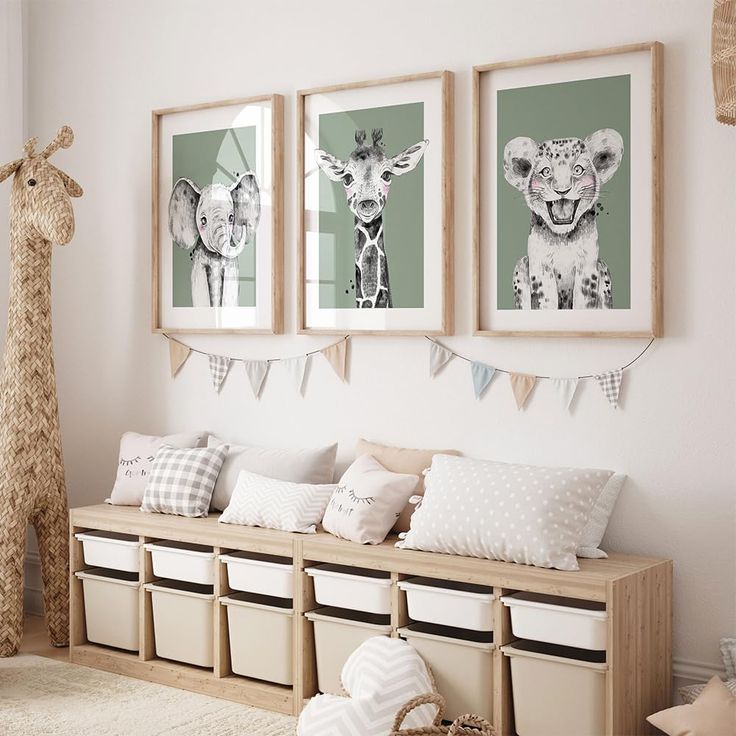 three framed pictures hang on the wall above a wooden bench with storage bins underneath